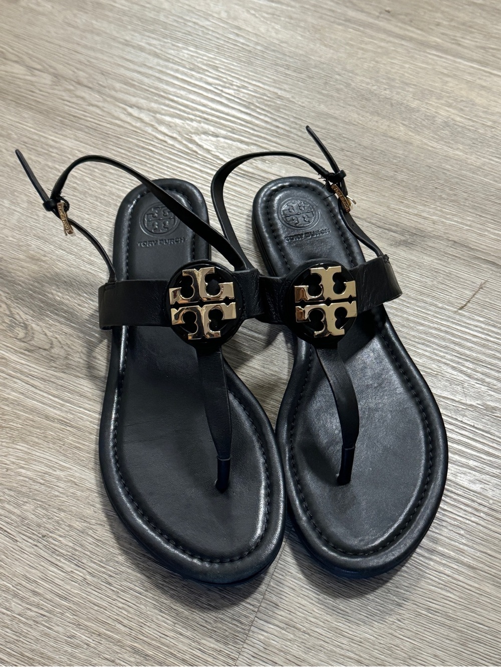Tory Burch Black Leather Logo T-Strap Sandals with Gold Emblem
